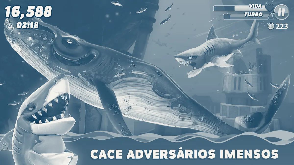 Baleia azulada com cracas a nadar sobre ruínas submersas, perseguida por um tubarão, com 16 588 pontos e 02:18 no relógio